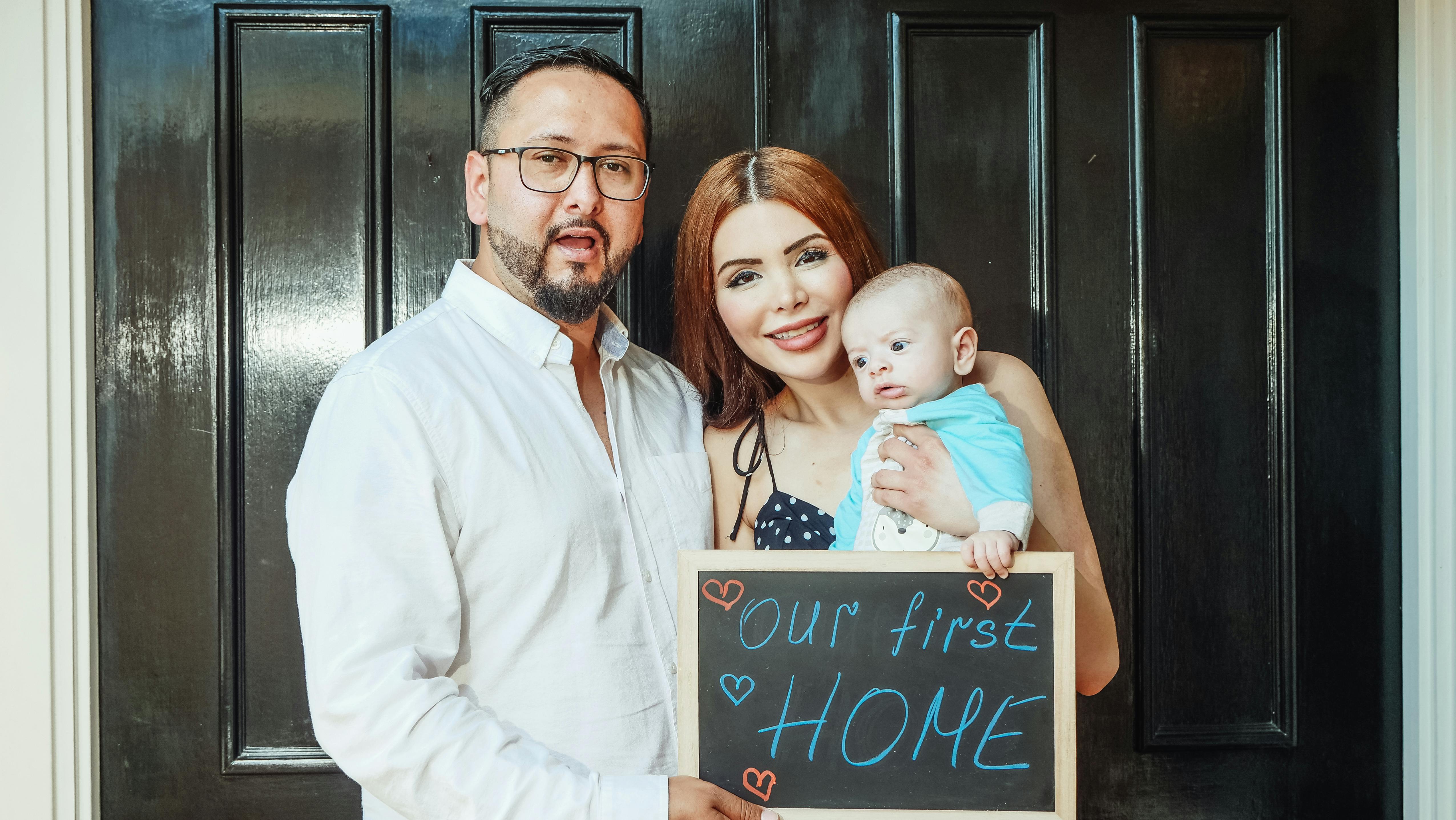 Family celebrating their first home purchase - representing our mission to create homeownership opportunities