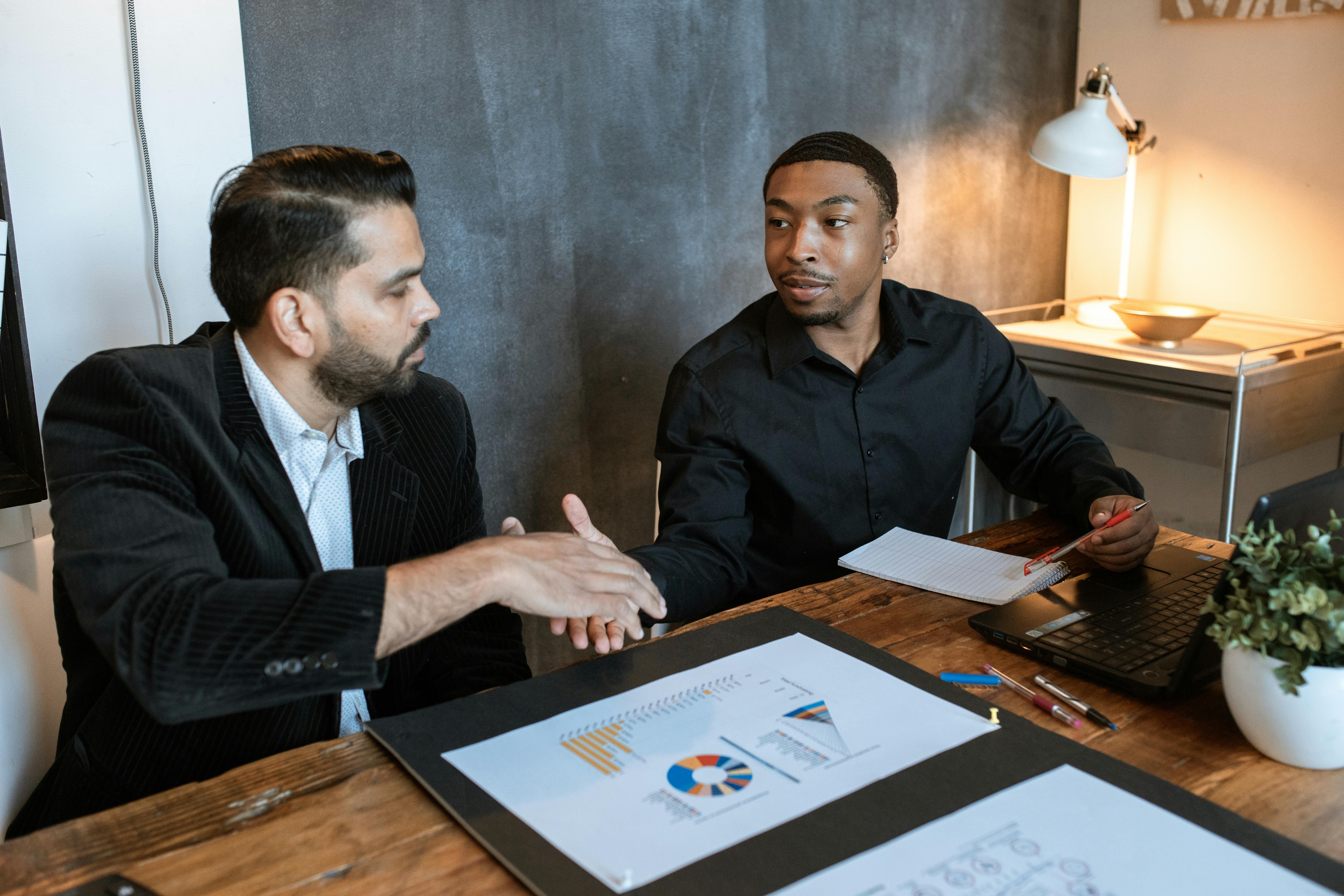 Business planning session with charts and documents